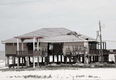 Wind damage - spray foam can help prevent uplift to Wilmington roofs